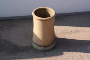 Yellow/Buff Chimney Pots with Small Cannons on Rooftop