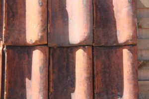 Reclaimed Clay Pan Tiles from Belgium, showcasing the unique texture and rich earthy tones of European architectural heritage.