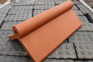 New Red Roll Top Ridge Tiles, offering a vibrant and durable solution for enhancing the apex of your roof with traditional elegance and modern performance.