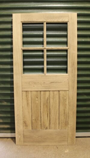Bespoke Smoked Oak Framed Door, top glazed, showcasing the unique charm of smoked oak combined with contemporary design elements.