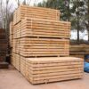 Brand-new, untreated oak railway sleepers with a rich natural grain, ready for garden landscaping or bespoke outdoor projects.