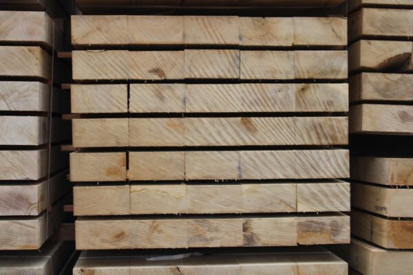 Brand-new, untreated oak railway sleepers with a rich natural grain, ready for garden landscaping or bespoke outdoor projects.