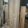 A bespoke, custom-sized 4 panel oak exterior door showcasing natural wood grain and traditional design.